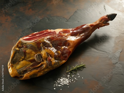 Gourmet prosciutto serrano ham whole leg delicious meat product display photo