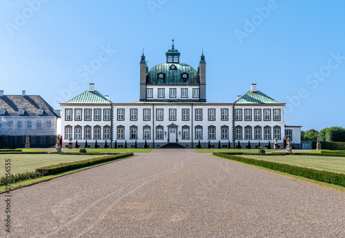 Fredensborg Palace main building in summer, the royal baroque residence in Denmark under a blue sky.