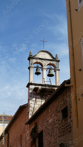 Fotografie two bells on a traditional bell gable on top of  St