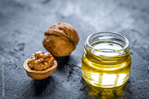 cosmetic and therapeutic walnut oil on dark background