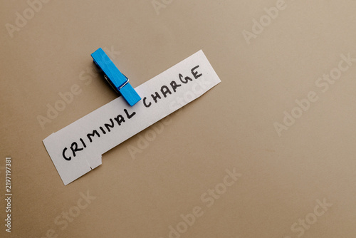 Quadro su tela Criminal charge note pinned with blue clip on beige background, legal concept pa