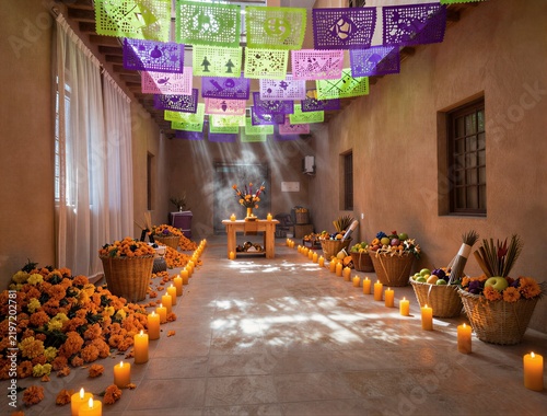 Altar corridor lined with candles marigolds and paper banners