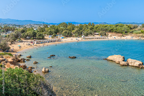 Scenic cove at Agii Apostoli beach near Chania in Crete, Greece, featuring calm turquoise sea and sandy beach in summer.