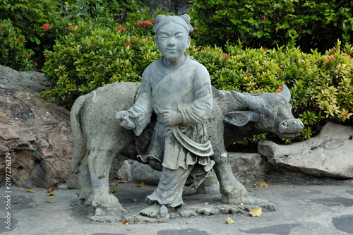 Photography Shepherd with buffalo sculpture
