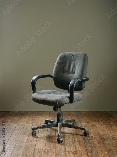 A worn office chair symbolizing years of work, familiarity and everyday persistence