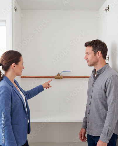 Property manager shows tenant the water shutoff valve location