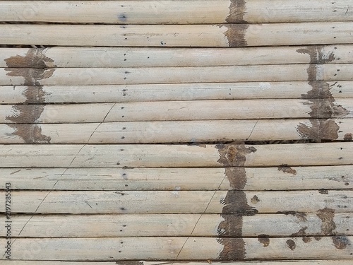 Weathered horizontal bamboo slat floor texture in rustic oriental design
