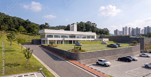 3d architectural rendering of a modern educational facility in the park