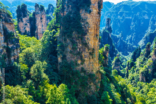 Canvastavla Aerial view of steep quartz sandstone rock pillars and dense green forest valleys in Zhangjiajie National Forest Park, Hunan, China