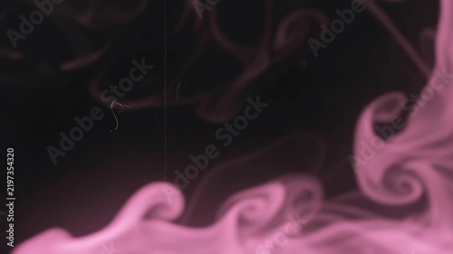 Pink smoky light leak frame over black background