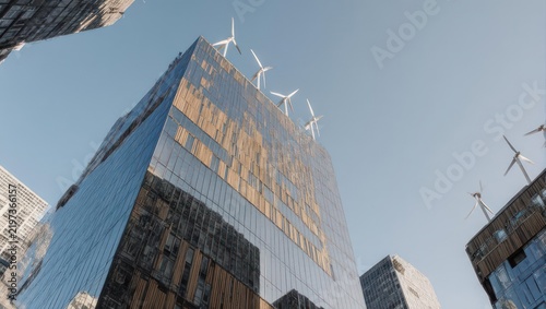 Modern skyscraper with wind turbines on top against blue sky.
