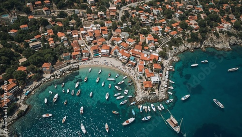 Coastal View of a Village With Boats in the Water at Midday