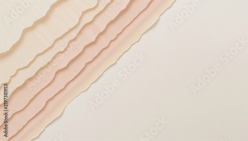 Layers of Textured Paper in Soft Colors on a Light Background