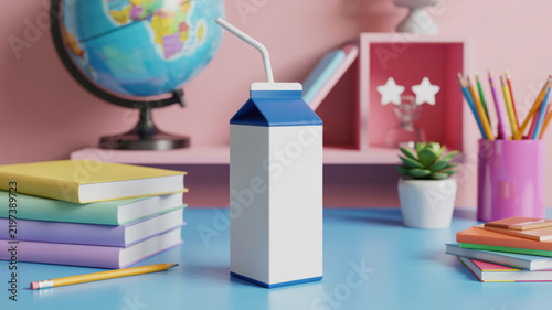 Milk carton package with straw on blue table near books and school items