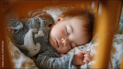 Beautiful newborn infant sleeping peacefully in his cradle with sweet dreams and rosy cheeks
