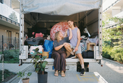 Young couple moving into a new home with all their belongings