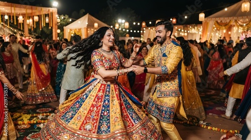 Happy Indian couple performing traditional Garba dance during Navratri festival