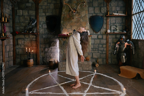 Принти на полотні Woman summoning mystical forces within ancient surroundings