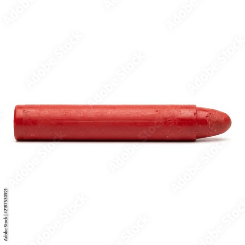Red lipstick in a cylindrical tube isolated on a white background with generous copy space