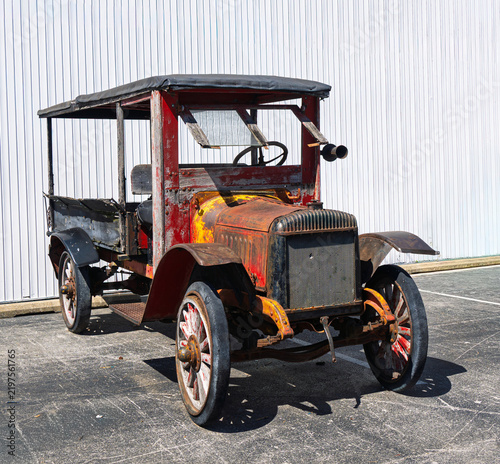 Vintage vehicle with heavy rust and faded color