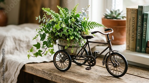 Decorative miniature bicycle planter with lush green ferns on a wooden table