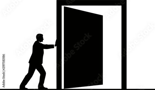 Silhouette of a businessman pushing open a large door representing new opportunities and corporate career advancement