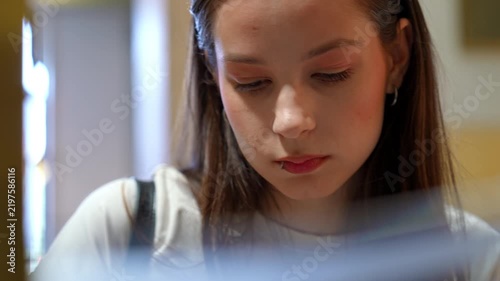Young woman concentrating on her work indoors