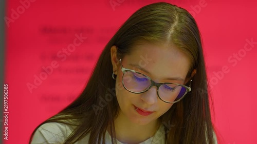 Young student with glasses studying thoughtfully