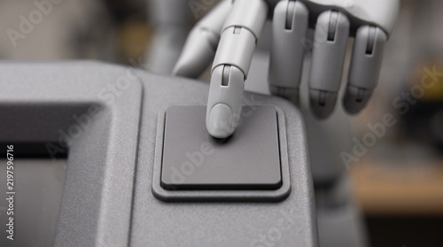 Robotic hand pressing a square button, futuristic humanoid finger interacting with control panel, artificial intelligence automation concept