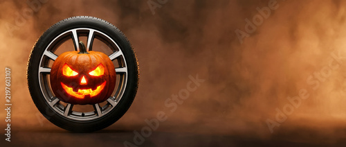 Glowing jack-o’-lantern with carved scary face inside a car wheel on a smoky background. Perfect for Halloween auto ads, festive banners, dealership promos, posters, and social media campaigns.