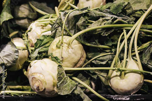 Quadro su tela Fresh kohlrabi vegetables with leaves background