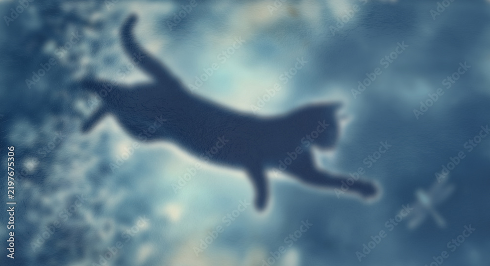 Fototapeta premium Silhouette of cat jumping through sky with dragonfly shows artistic dreamlike nature scene for background.