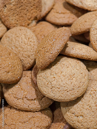 Oatmeal cookies arranged on a supermarket display, featuring fresh sweet baked products presented attractively for customers choosing from the bakery selection