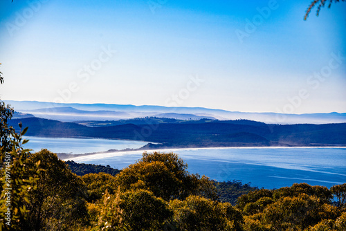 фотографія Amazing aerial photo of an isthmus in lap of nature and trees with beach view an