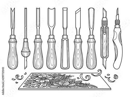 Konstfotografi Wood carving tools set with various chisels gouges and a floral carved wooden panel