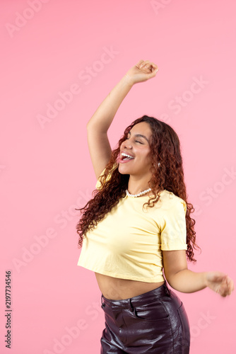 Young black woman celebrating success with joy