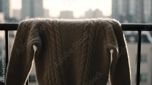 Knitted Sweater Hanging On Balcony Railing. 4K Video