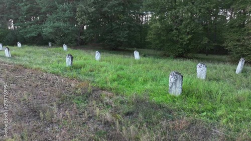 Aerial Torun Poland Soviet soldiers cemetery forest slide. Stalag XXI-C was a German Army World War II prisoner of war camp. Memorial is mass graves of over 14,000 prisoners executed. Historical.