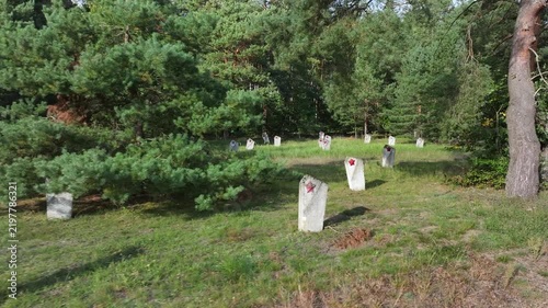 Aerial Torun Poland Soviet soldiers cemetery forest slide. Stalag XXI-C was a German Army World War II prisoner of war camp. Memorial is mass graves of over 14,000 prisoners executed. Historical.