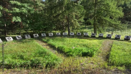 Aerial Torun Poland Soviet soldiers cemetery forest pull. Stalag XXI-C was a German Army World War II prisoner of war camp. Memorial is mass graves of over 14,000 prisoners executed. Historical.