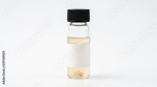 Small Glass Vial With Clear Liquid And Blank White Label On Isolated White Background