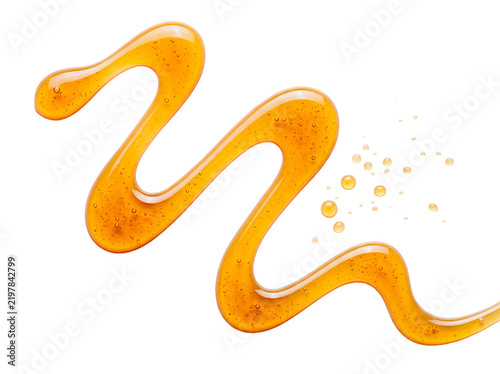 Honey syrup drizzle wave isolated on black background