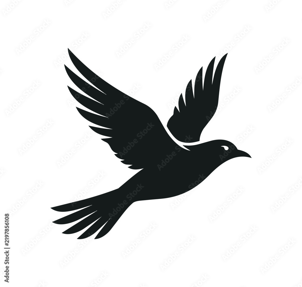 Fototapeta premium Silhouette of a black bird in flight.