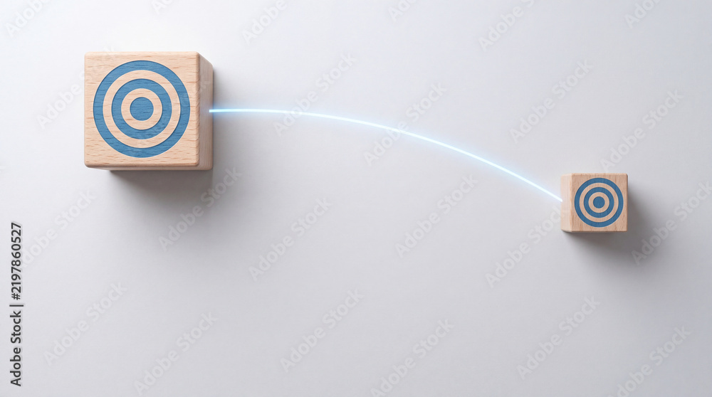 Obraz premium Concept of Digital Financial Transaction and Money Transfer Represented by Wooden Blocks with Target Icons and a Glowing Blue Connection Line on a Neutral Minimalist Background