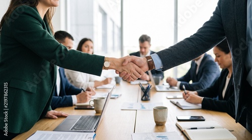 Partners corporate relationship concept. Close up handshake of business people in meeting attendance.
