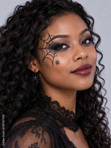 Woman with Spiderweb Makeup and Spider Earring, Halloween