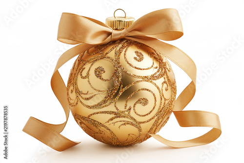 A shimmering golden Christmas ornament adorned with intricate swirls and a satin ribbon is beautifully displayed, exuding elegance and festive cheer.