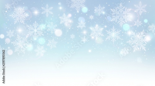 Soft light blue winter background with delicate white snowflakes and glowing bokeh, clean seasonal design for Christmas and holidays