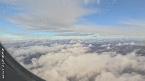 Passenger window view over Austrian countryside approaching Vienna International Airport.