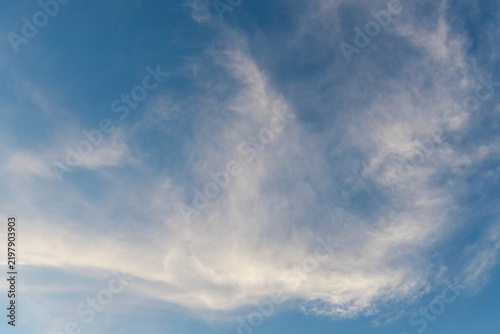 Thin streak of clouds in the sky.